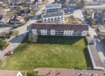 Ansicht - Investition mit Zukunft: Mehrfamilienhaus mit 18 Wohnungen, 7 Garagen und 10 Stellplätzen